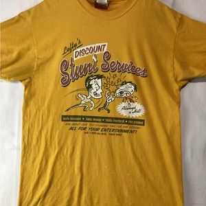 Vintage Universal Studios T-Shirt Size Medium Lefty’s Stunt Services Worn Flaws.